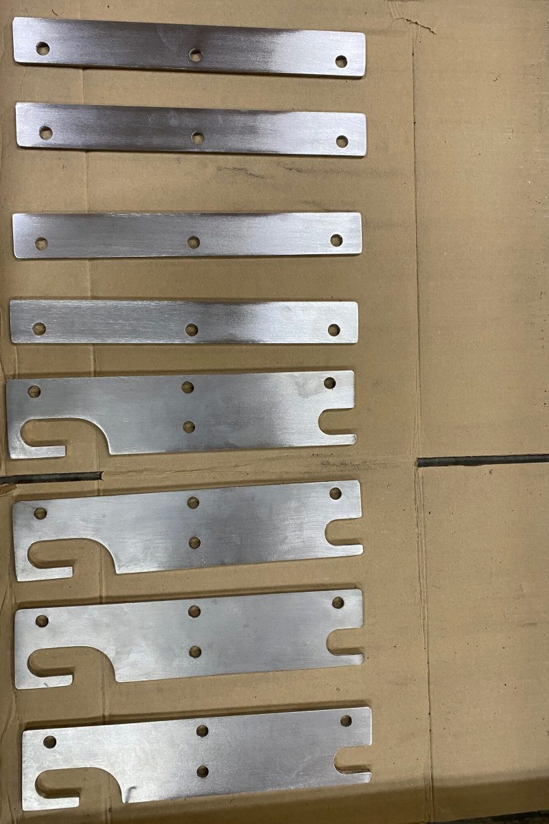 8 of the 400 plates cut out and boxed up with hardware in 50 kits